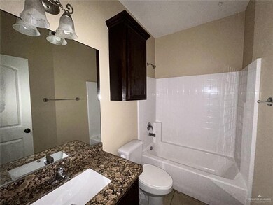 Full bathroom with shower / washtub combination, vanity, toilet, and tile patterned flooring