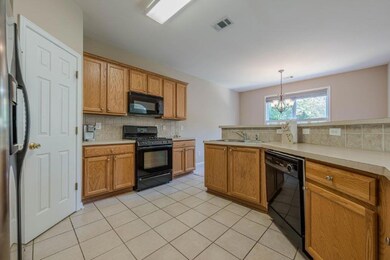 Spacious kitchen with generous counter space.