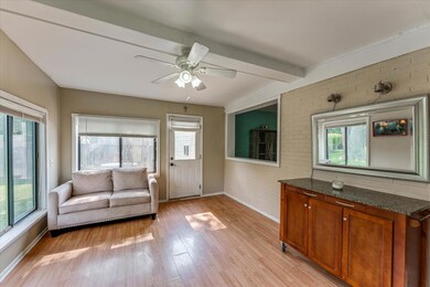 4 season room that is open to kitchen