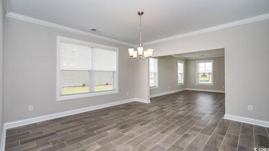 Unfurnished room with crown molding, dark wood-typ