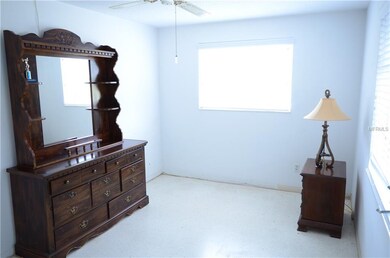 Master bedroom also has terrazzo floors and two wi