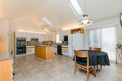 Large kitchen with eat-in area and skylights