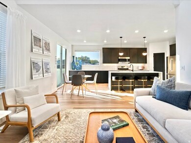 Living room with light wood-style floors and recessed lighting