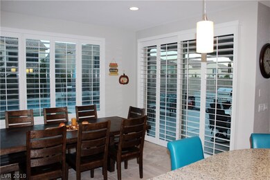 Dining room and sliding plantation shutters. View