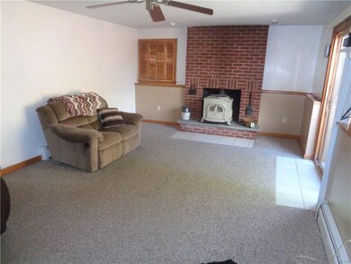 LARGE FAMILYROOM WITH WOODSTOVE! SLIDER LEADS TO P