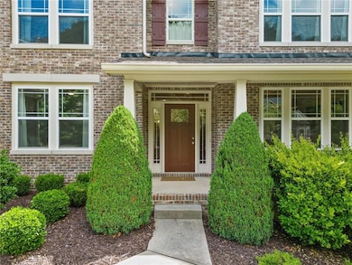 Doorway to property with brick siding