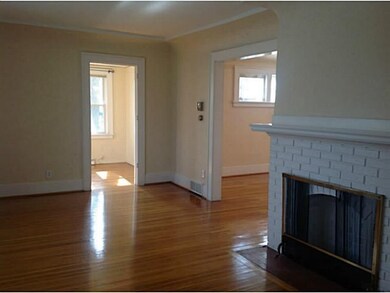 Living Room. The living room has a fireplace and c