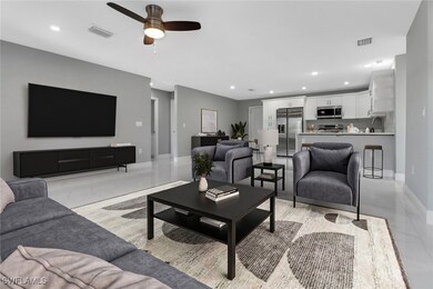 Living room with sink and ceiling fan