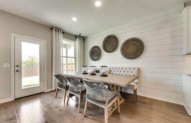 Dining area off kitchen *Photos of furnished model