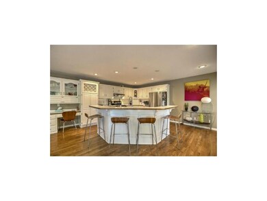 Spacious island kitchen with large pantry and brea