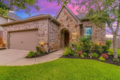 Welcome to 2610 Misty Laurel Court, look how lovely this 1.5 home with 4/3/2 home is absolutely amazing! This stunning home has lovely curb appeal, a well-manicured lawn, beautiful landscaping, stone/brick elevation, dark stained front door, and a double wide driveway!
