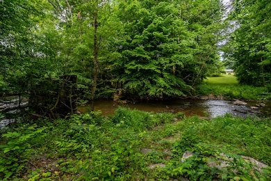 Peaceful Creek borders property
