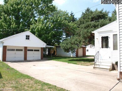 2 car garage with covered patio on side