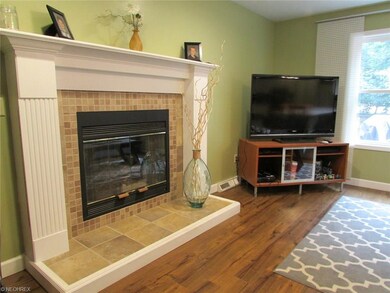 The gas fireplace has been updated to maintain its