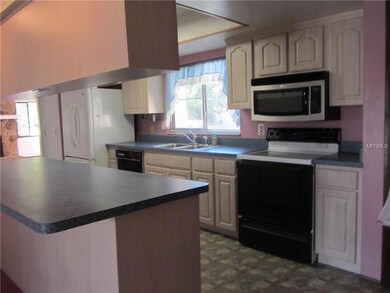 Very spacious kitchen with a breakfast bar.
