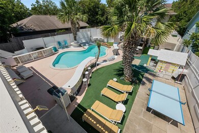 Community pool featuring a patio and a fenced bac