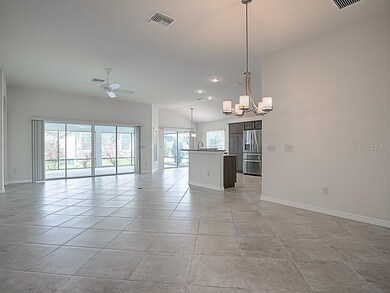 THE LIVING AND CASUAL DINING ROOM OPEN WITH SLIDIN
