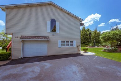 A paved driveway that can accomodate 7-9 vehicles,