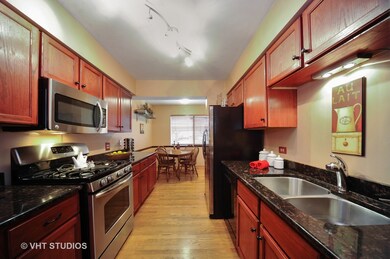 Classy Galley Kitchen with Upgraded wood cabinets 