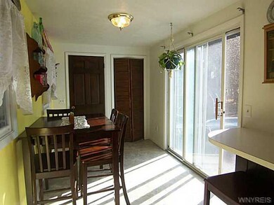 Breakfast Room. BREAKFAST BAR W/SLIDING GLASS DOOR