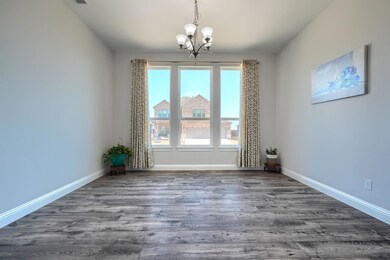 Unfurnished room featuring hardwood / wood-style f