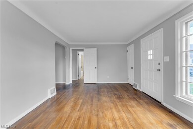 Entryway with dark hardwood flooring and plenty of natural light