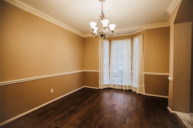Captivating formal dining room steps away from foy