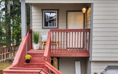 Right outside the front door, this covered porch is the perfect place to greet guests or pause for a moment before heading in.