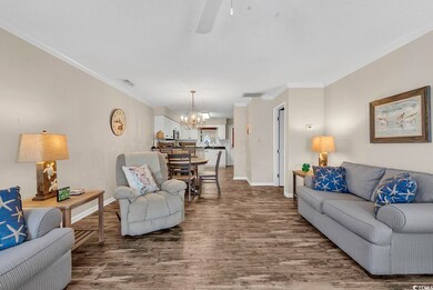 Living area featuring baseboards, visible vents, d