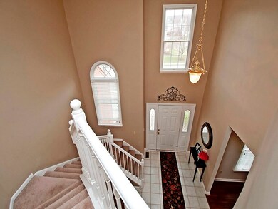 Dramatic turned staircase overlooking the two stor