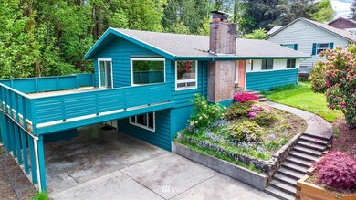 Huge deck overlooking all the greenery around this home!