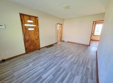 Living room 1st floor. front door, main bedroom, l