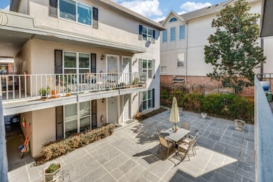 Rear view of property with a patio area and stucco