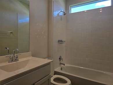 Bathroom with vanity, washtub / shower combinatio