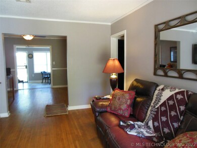 Living room through dining room to bonus room.