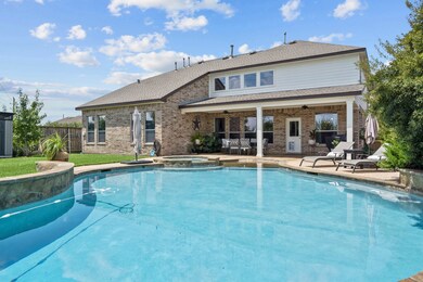 Large pool with hot tub, oversized covered back patio and plenty of yard with lush landscaping!