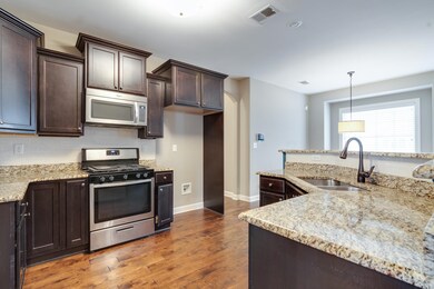 Kitchen featuring sink, tasteful backsplash, appli