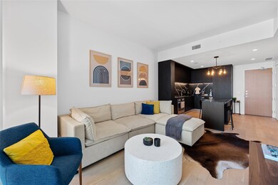 Living room featuring light wood-style flooring a
