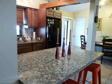 Granite in kitchen and note the upgraded cabinets!!!