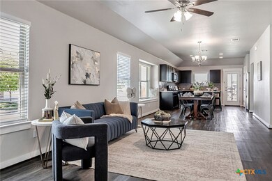 Living room open to dining and kitchen