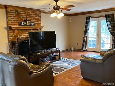 Great room featuring wood flooring, ceiling fan, a