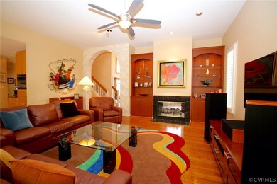 Family Room with built in cabinets, fireplace, bos