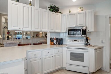 Kitchen featuring stainless steel microwave, elect