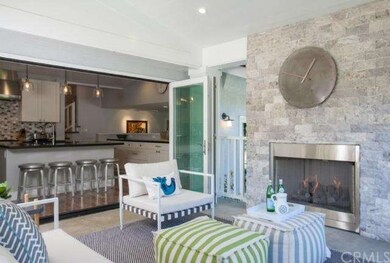 The stunning outdoor room and fireplace trimmed in