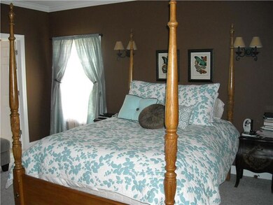 Master bedroom is spacious and offers an additional sitting area.