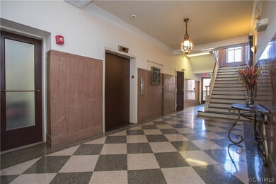 Wide staircase and elevator greet you in the lobby