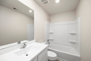 The secondary bathroom, located centrally in the h
