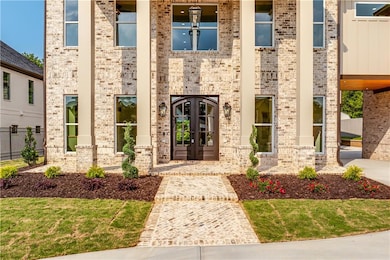 Entrance to property with brick siding
