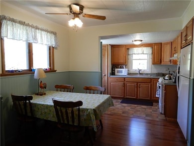 Dining area is conveniently open to the kitchen ac