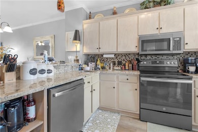 Kitchen featuring ceiling fan, stainless steel app